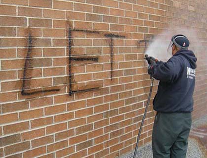 Graffiti removal on brick