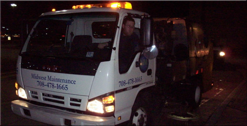 Midwest Maintenance Services sweeper truck on an overnight parking lot route