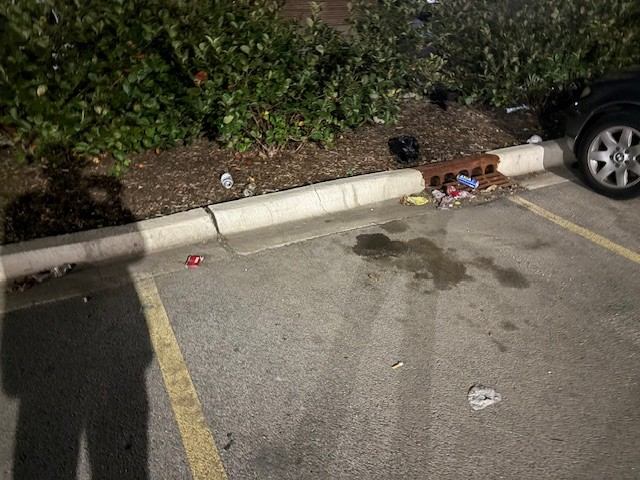 Before: Overnight porter litter pick-up along parking stalls