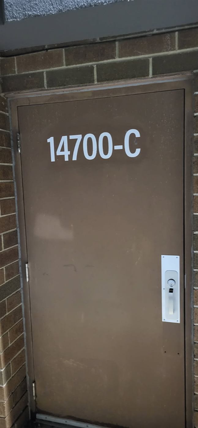 After: Suite number installed on a service door
