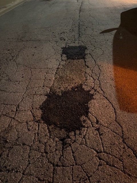 After: Overnight pothole patching in a drive lane