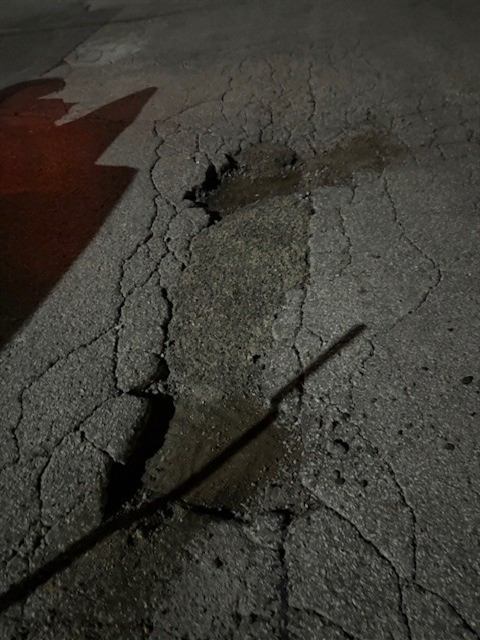 Before: Overnight pothole patching in a drive lane