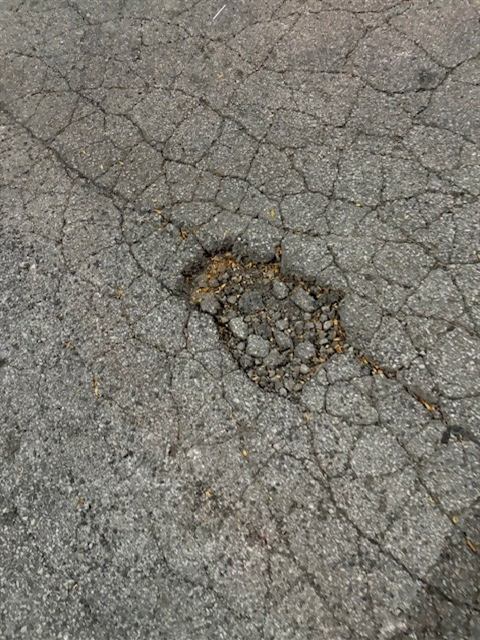 Before: Cold patch pothole repair