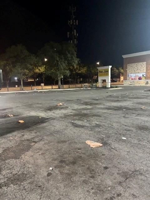 Before: Trash and debris swept from the parking lot overnight