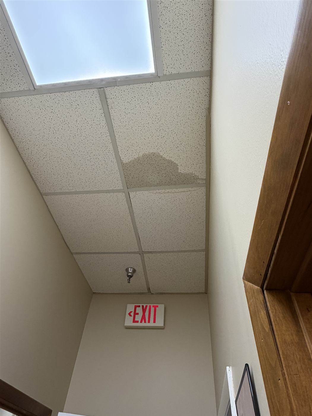 Before: Water-stained ceiling tiles replaced