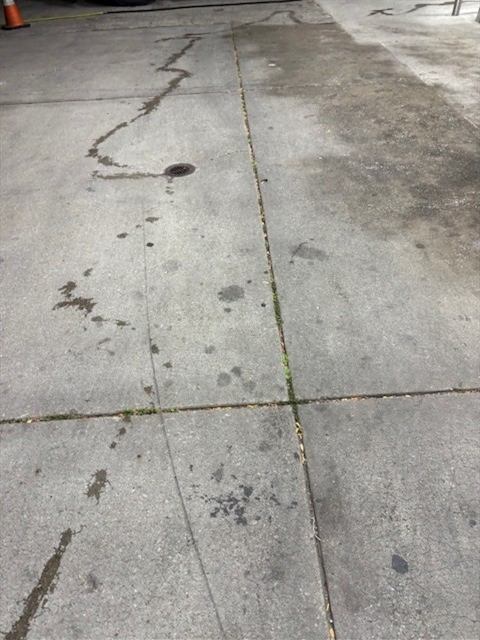 Before: Gas station sidewalk power washing