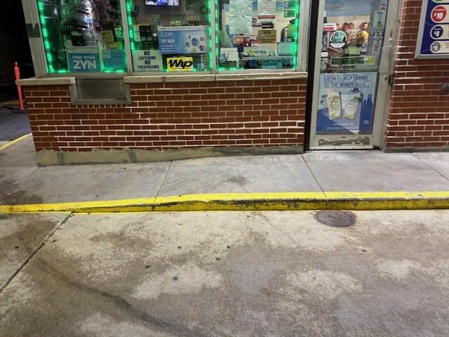 Before: Storefront and apron washed