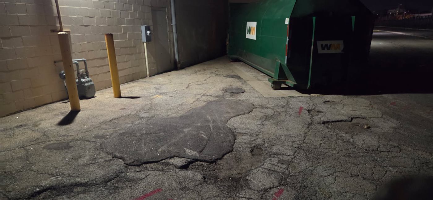 After: Dumpster pad cleaned with hot water