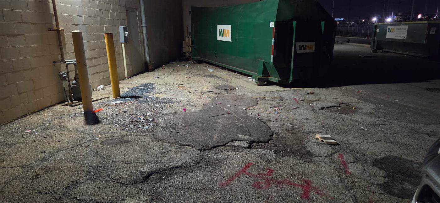 Before: Dumpster pad cleaned with hot water