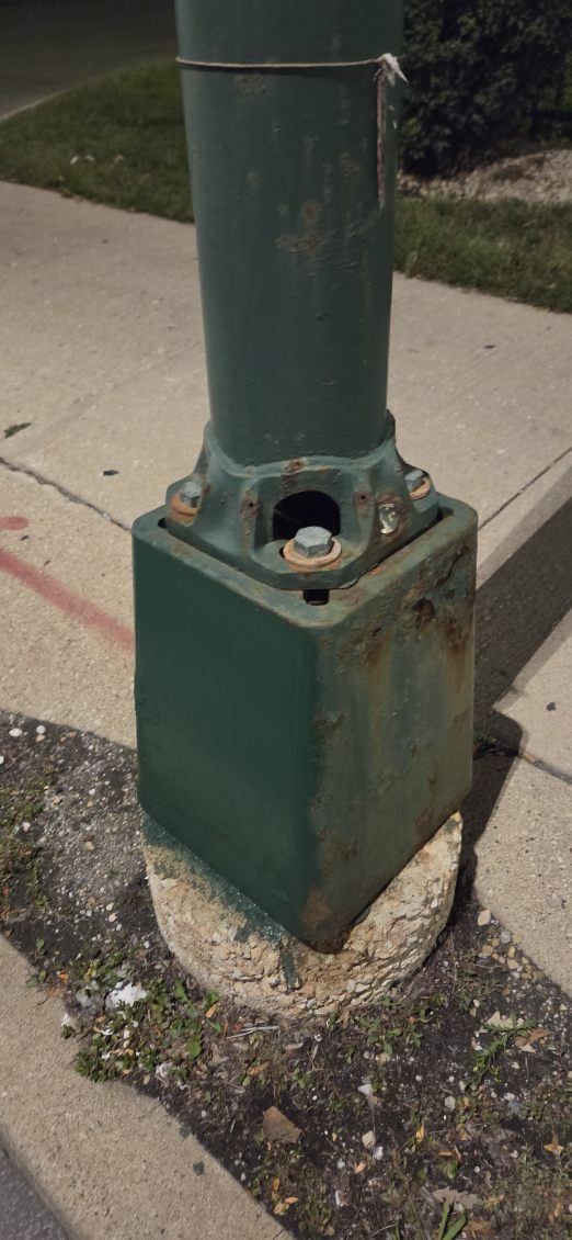 After: Graffiti removed from a light pole base