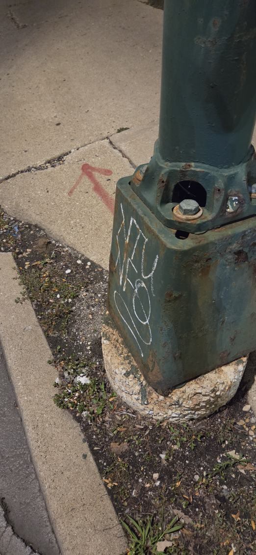 Before: Graffiti removed from a light pole base