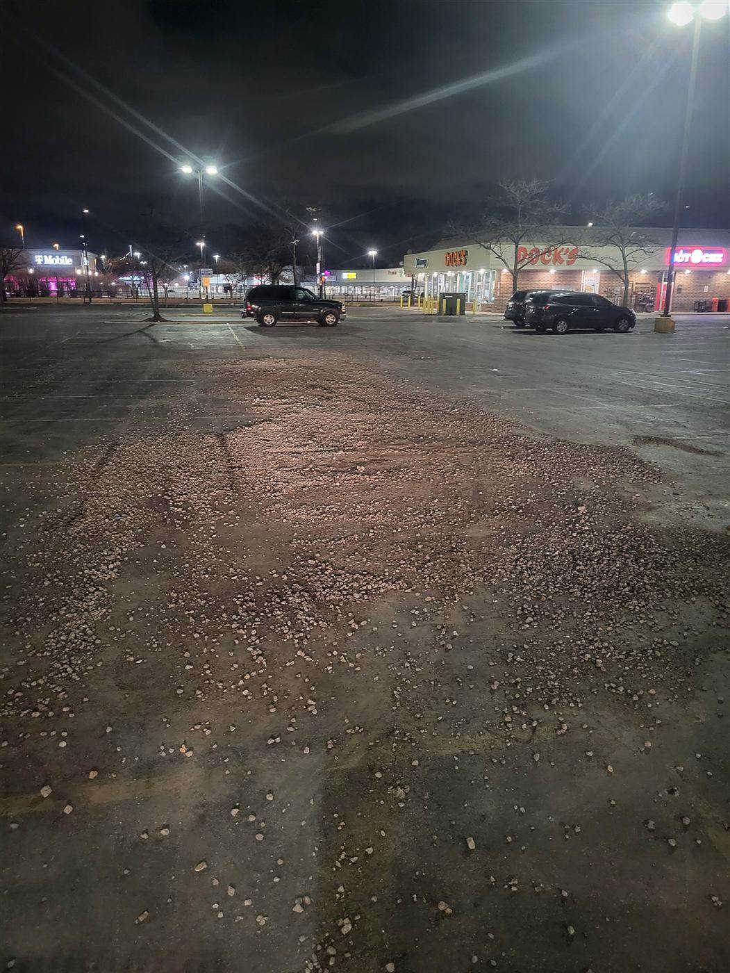 Before: Sweeping: winter sediment and grit swept from the parking lot