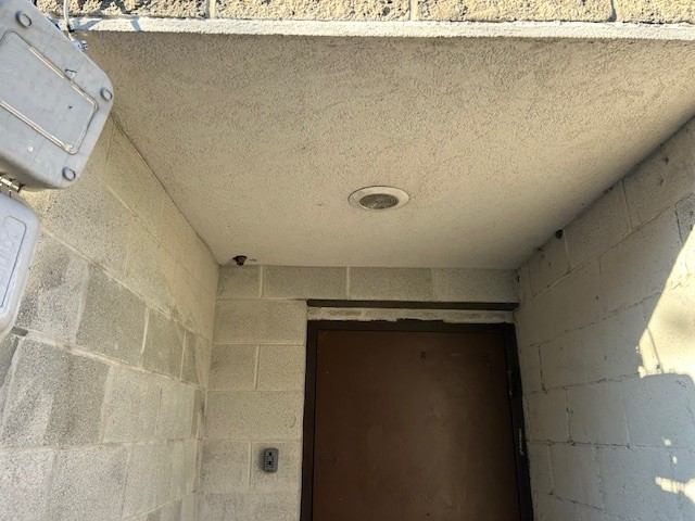 Light bulb replacement over a service door