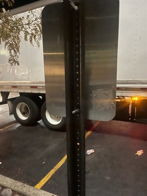 After: Stickers removed from a parking sign by our porter