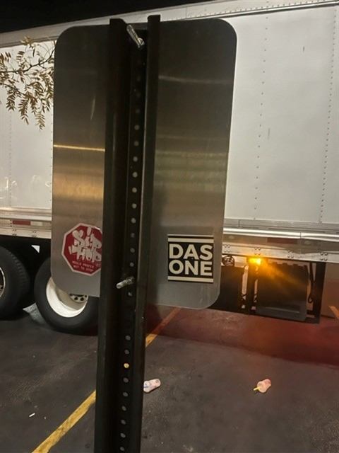 Before: Stickers removed from a parking sign by our porter