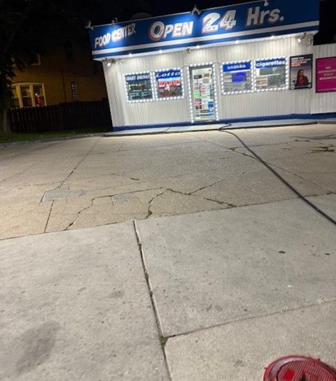 Before: Convenience store apron power washing