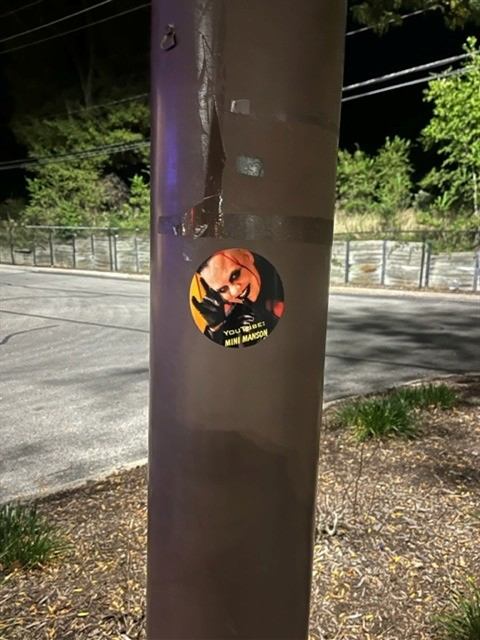 Before: Sticker removed from a light pole