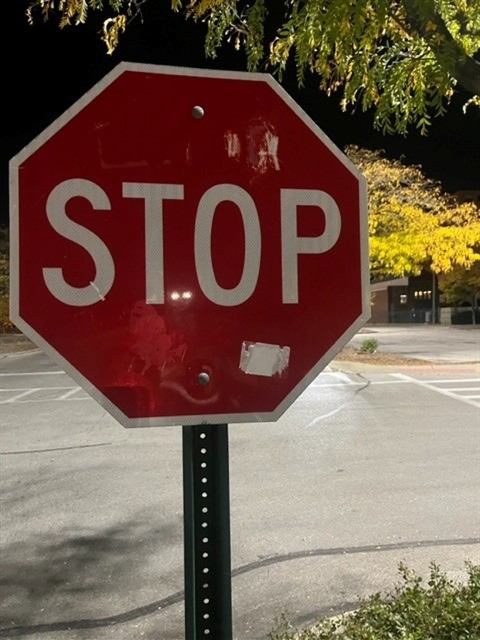 Before: Stickers removed from a stop sign