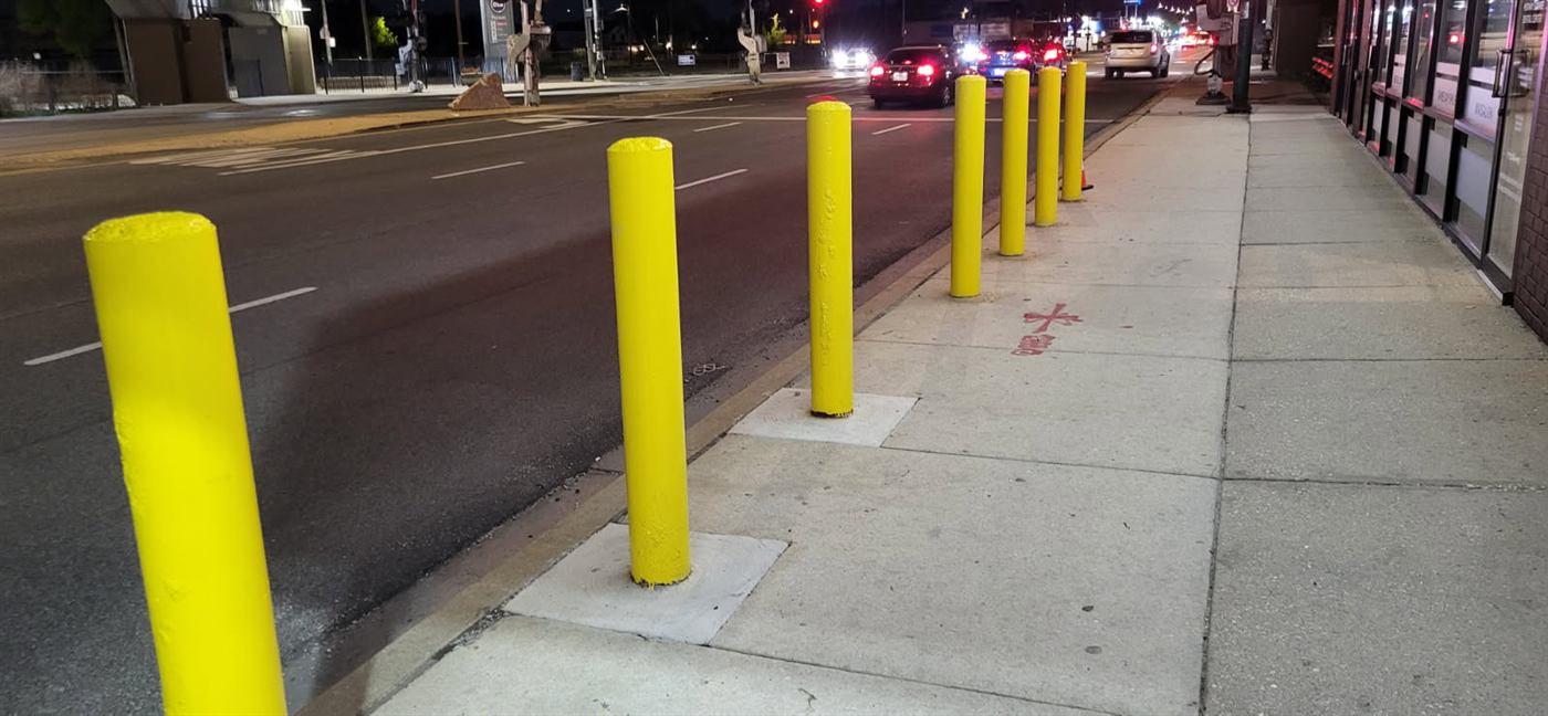 After: Storefront bollards repainted