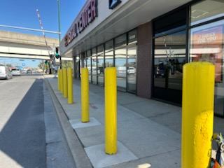 After: Stickers removed from storefront bollards