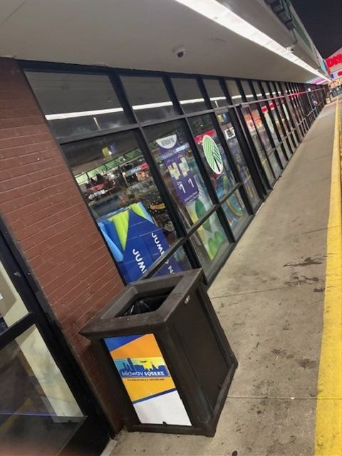 After: Storefront trash receptacle emptied and sidewalk policed