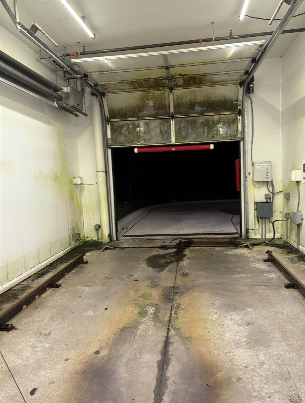 Before: Car wash bay floor degreased