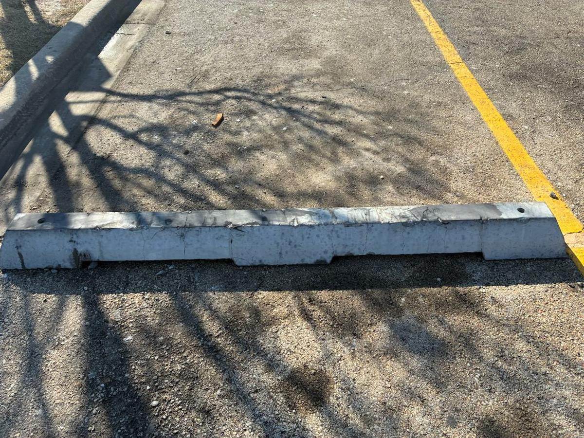 After: Graffiti removed from parking lot curb stops
