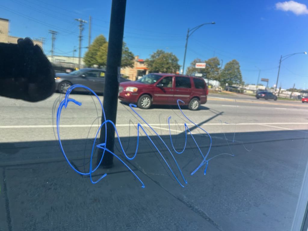 Before: Graffiti removed from a sidewalk and pole