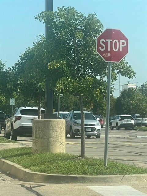 Before: Damaged stop sign replaced