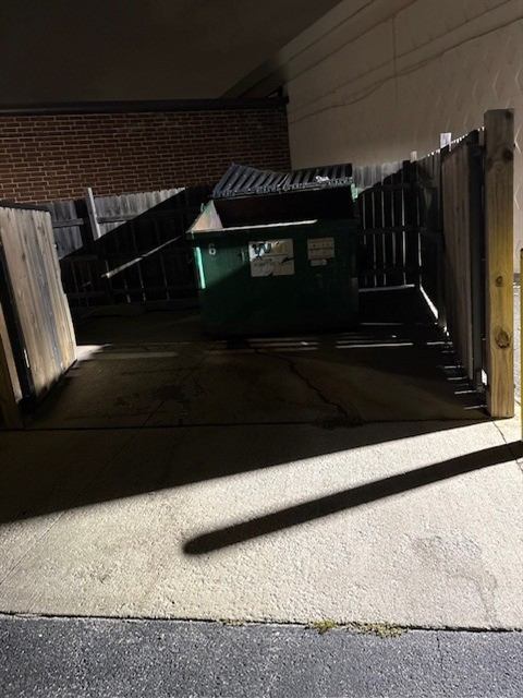 After: Fly-dumped materials removed from a trash enclosure