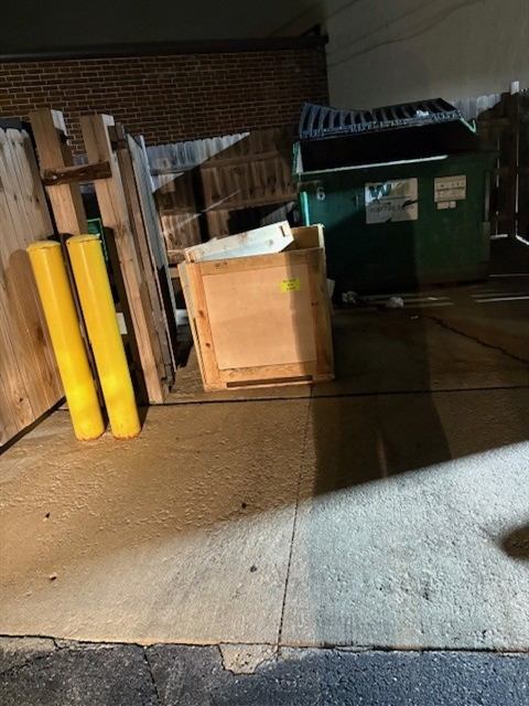 Before: Fly-dumped materials removed from a trash enclosure