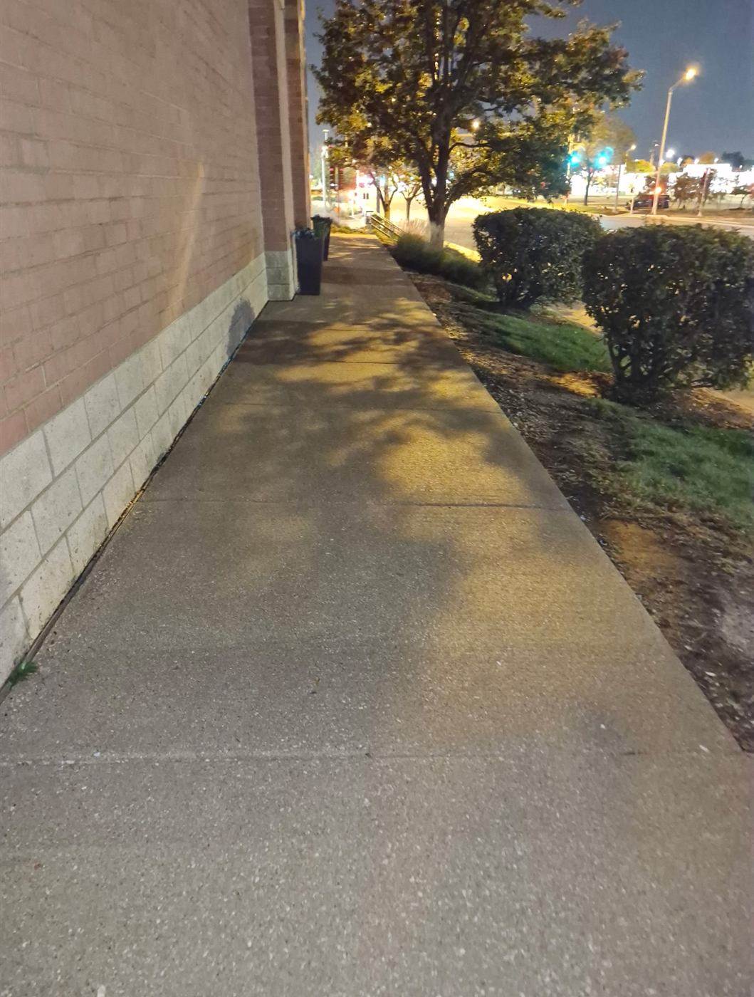 Sidewalk power washing at a retail center