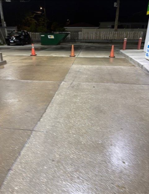 Freshly washed gas station concrete