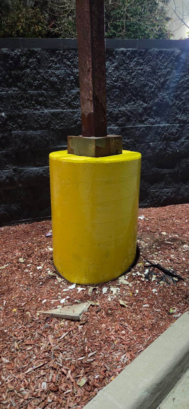 After: Light pole base cover installed and painted