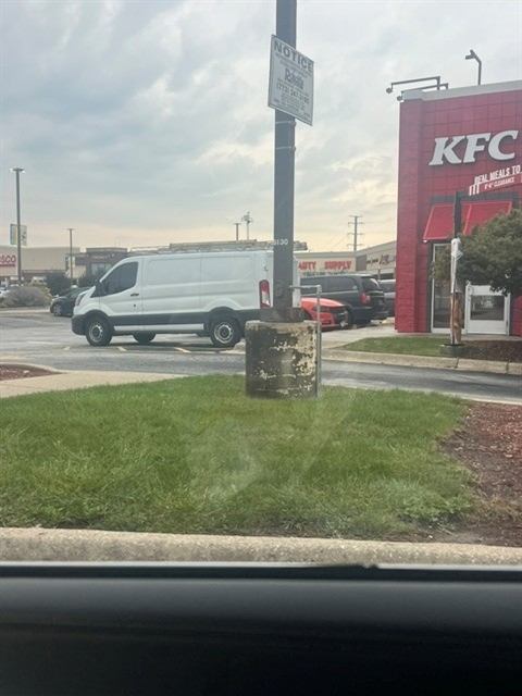 Before: Damaged light pole base reported by our porter and repaired