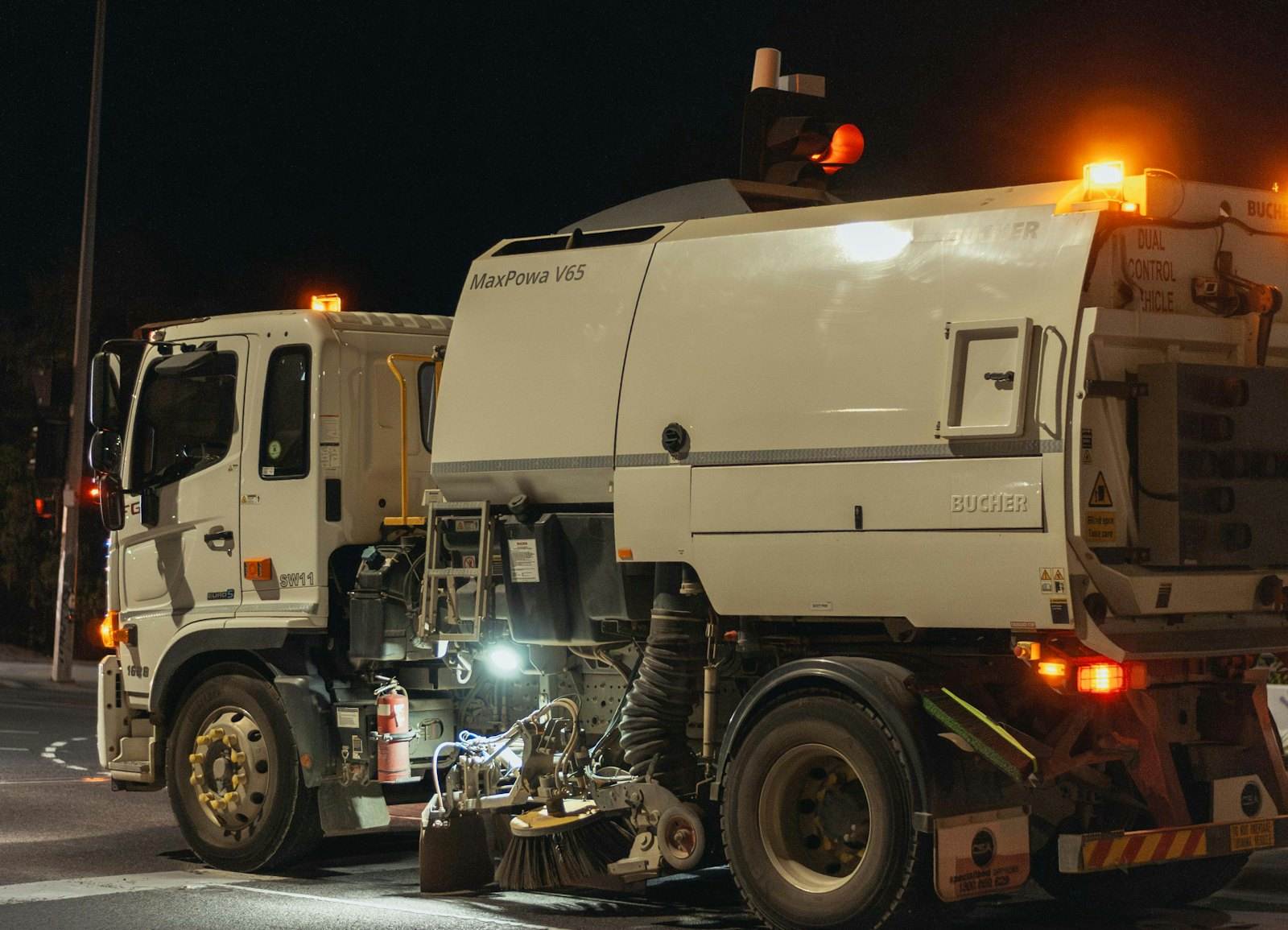 Midwest Maintenance Services sweeper truck on an overnight parking lot route